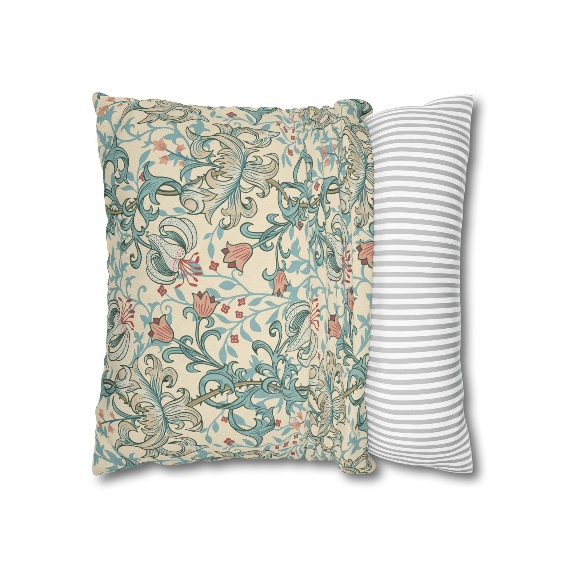 Two pillows, one with floral pattern and one with stripes, on a white background