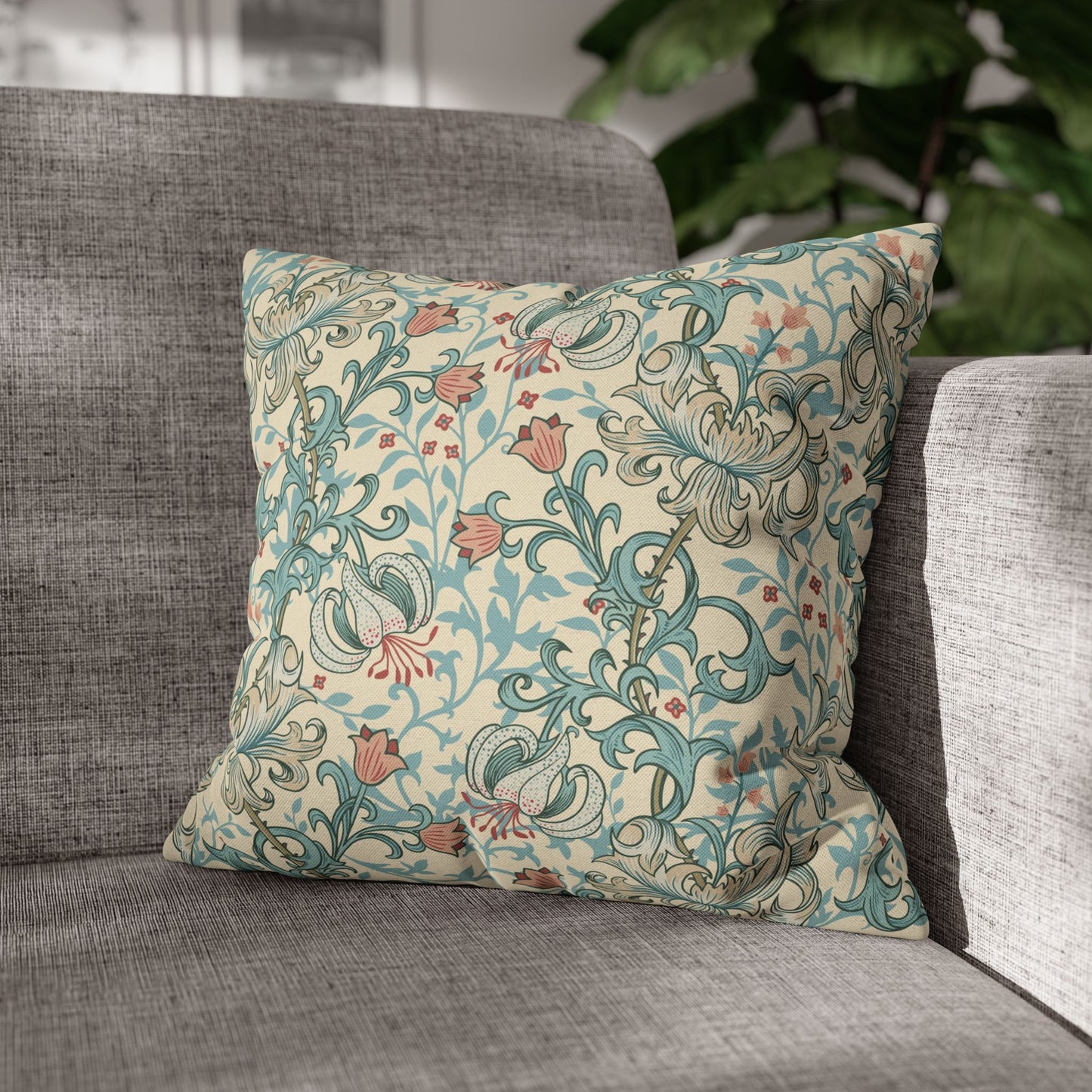 Decorative pillow with floral pattern on a gray sofa