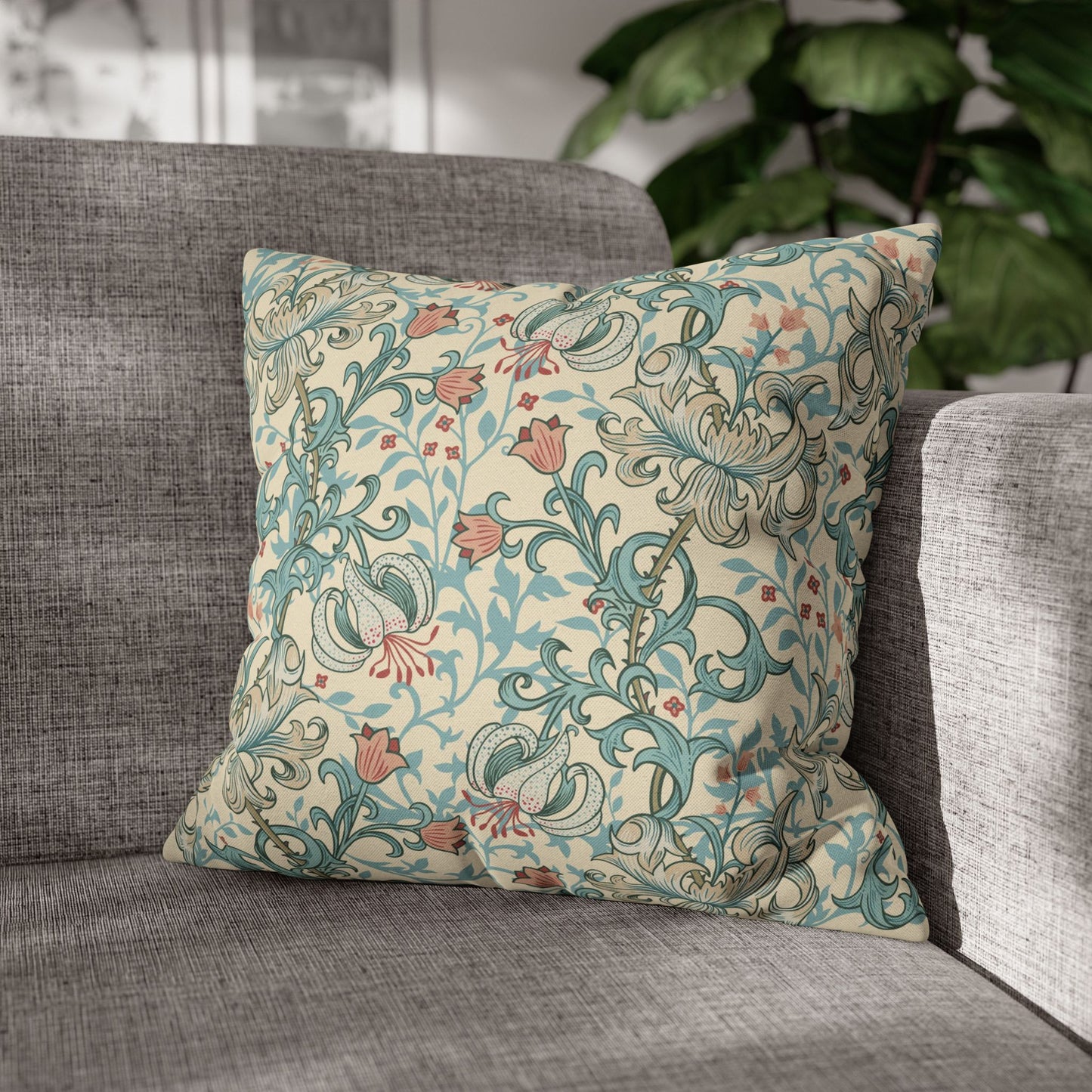 Decorative pillow with floral pattern on a gray sofa