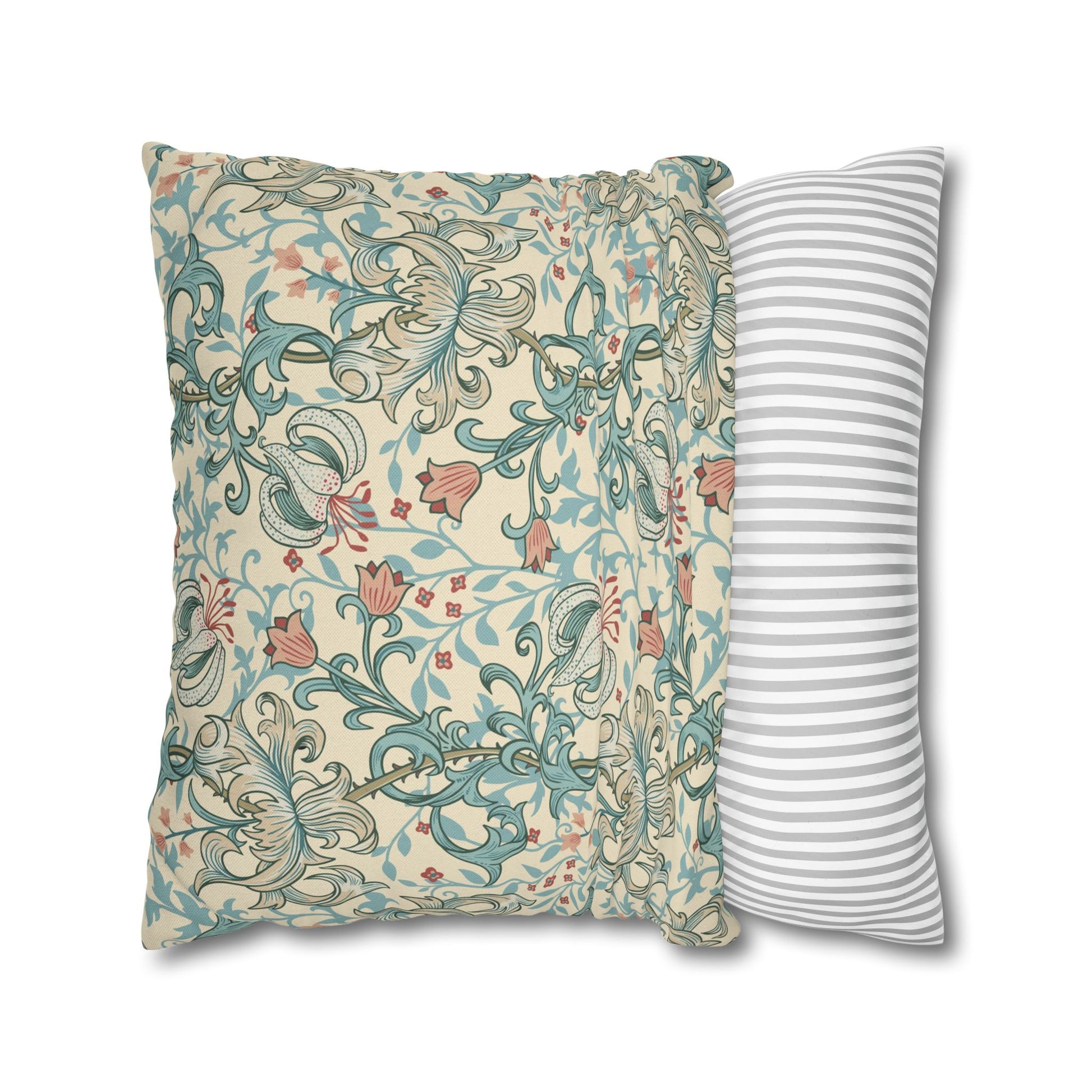 Two pillows, one with floral pattern and one with stripes, on a white background