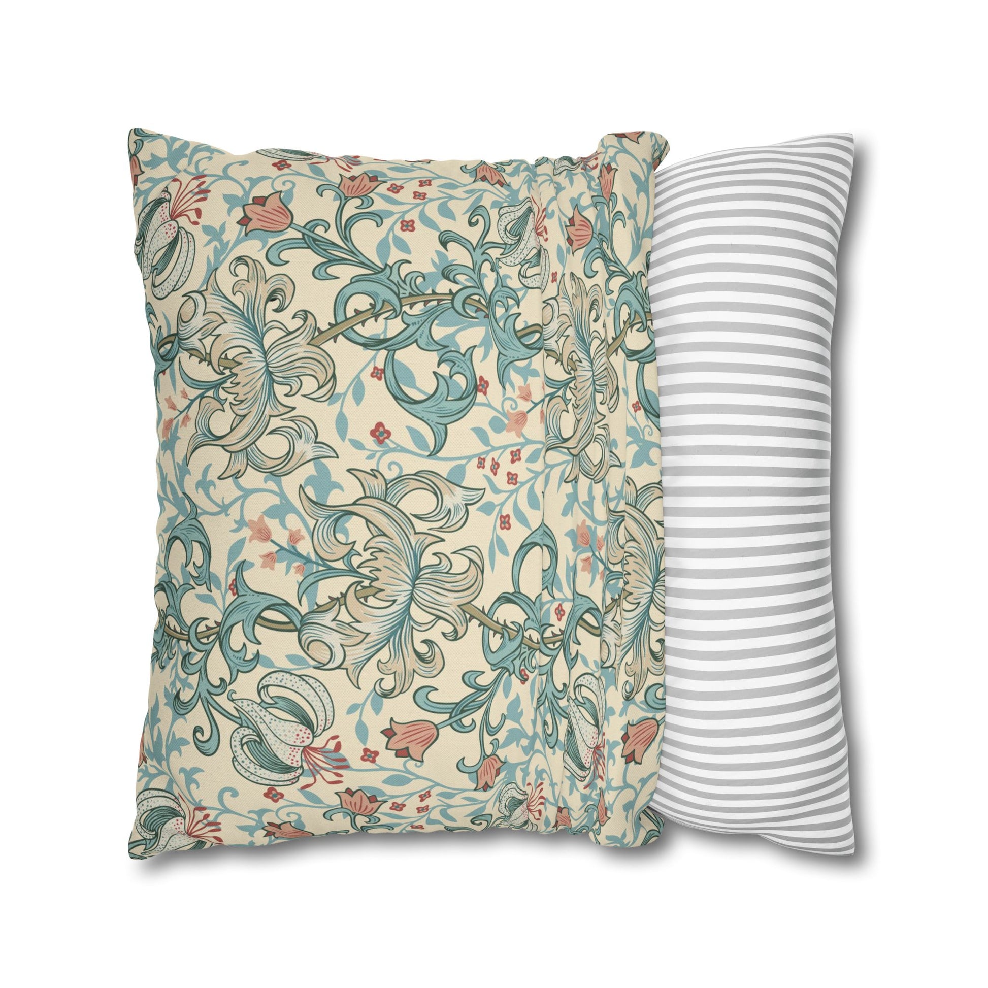 Two pillows, one with floral pattern and one with stripes, on a white background