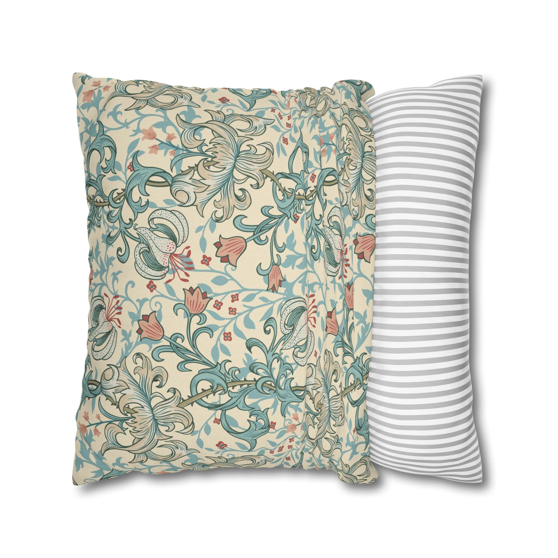 Two pillows, one with floral pattern and one with stripes, on a white background