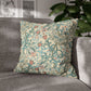 Decorative pillow with floral pattern on a gray sofa