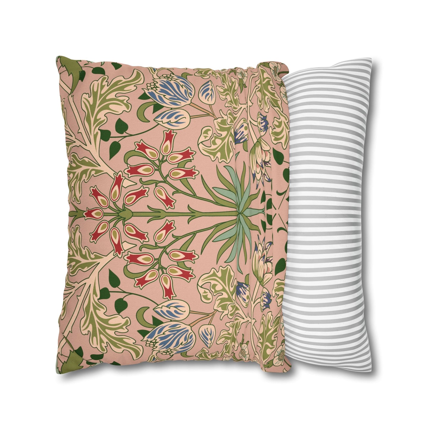 Two pillows, one with floral pattern and one with stripes, on a white background