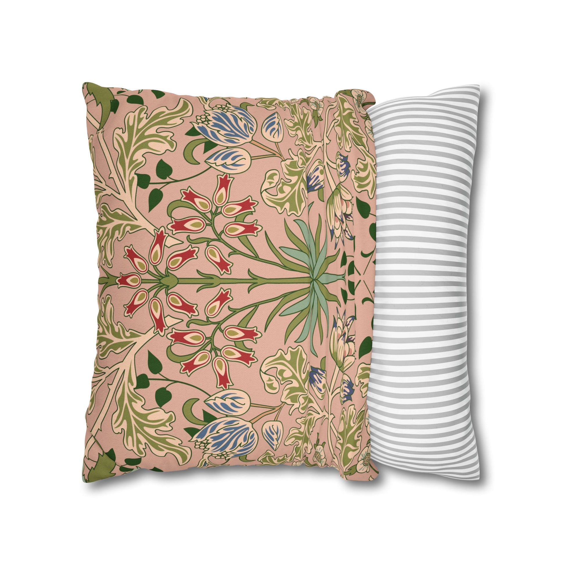 Two pillows, one with floral pattern and one with striped pattern, on a white background.