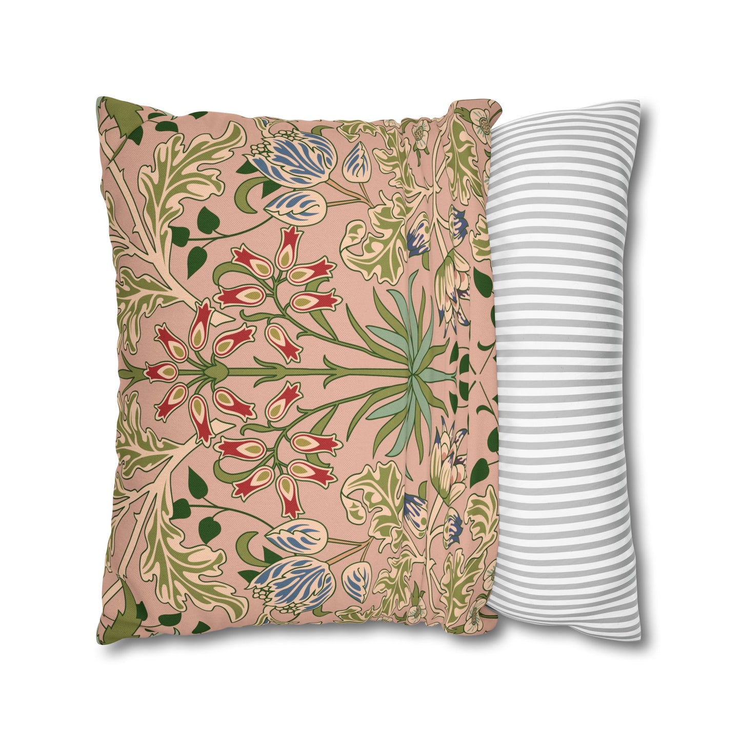 Two pillows, one with floral pattern and one with stripes, on a white background