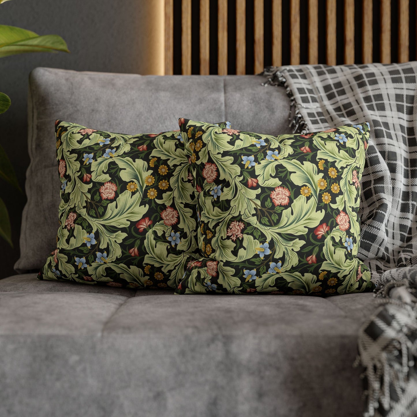 Decorative pillows with floral pattern on a gray sofa - William Morris Leicester