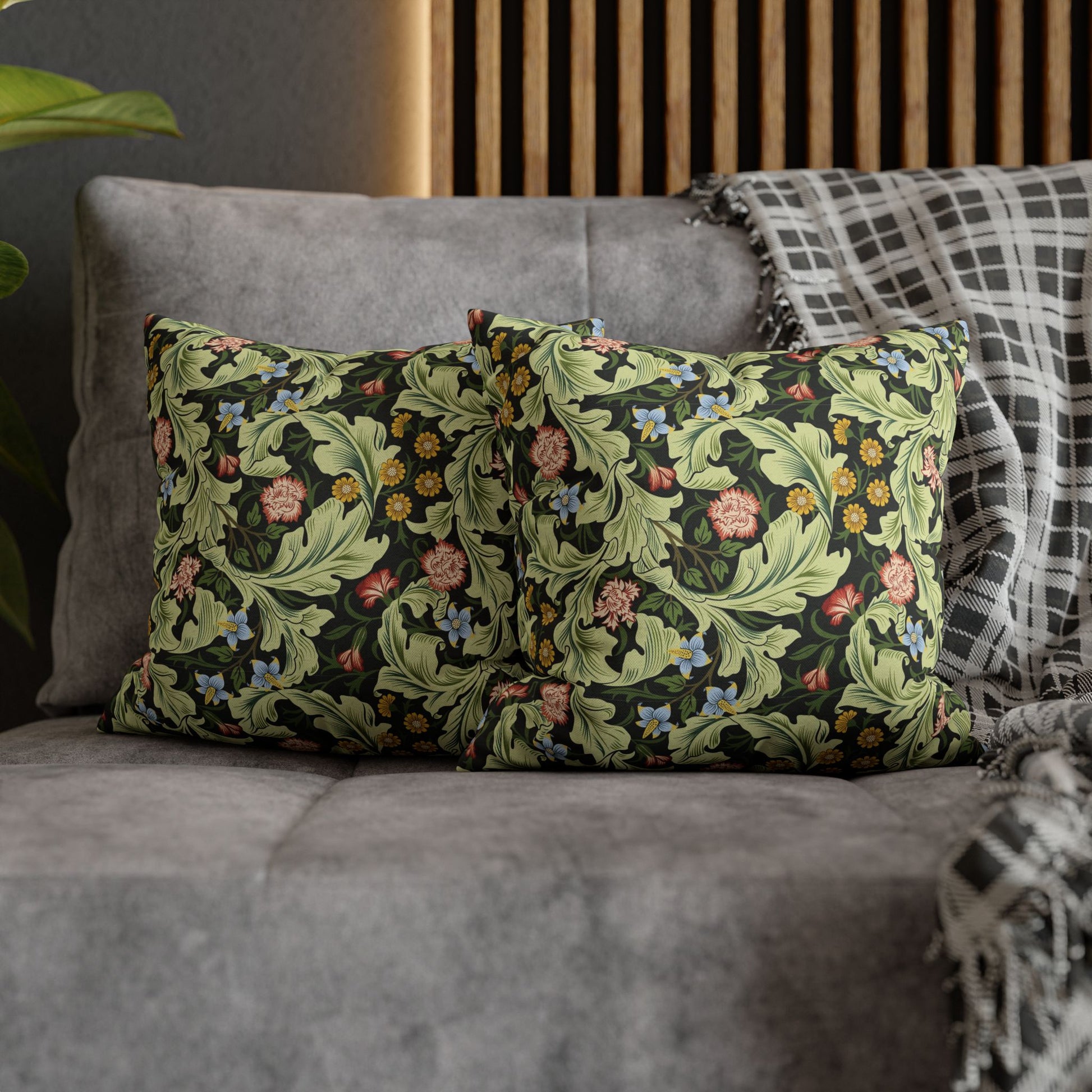 Decorative pillows with floral pattern on a gray sofa - William Morris Leicester