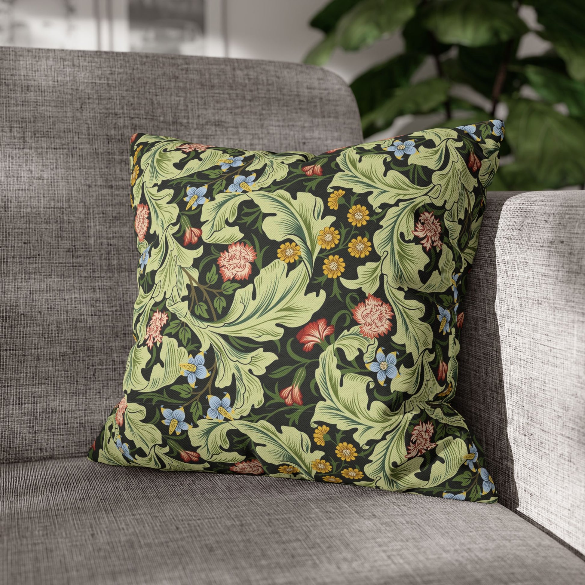 Decorative pillow with floral pattern on a gray sofa - William Morris Leciester