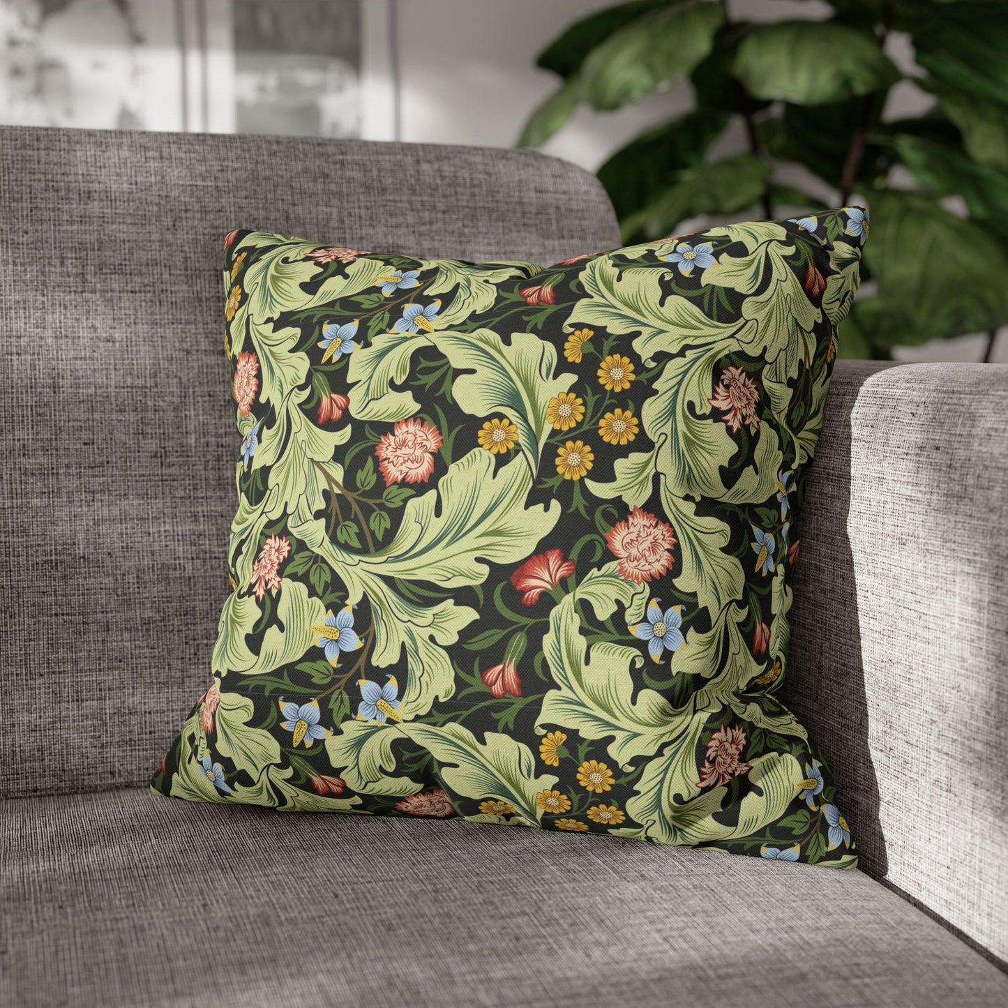 Decorative pillow with floral pattern on a gray sofa - William Morris Leicester
