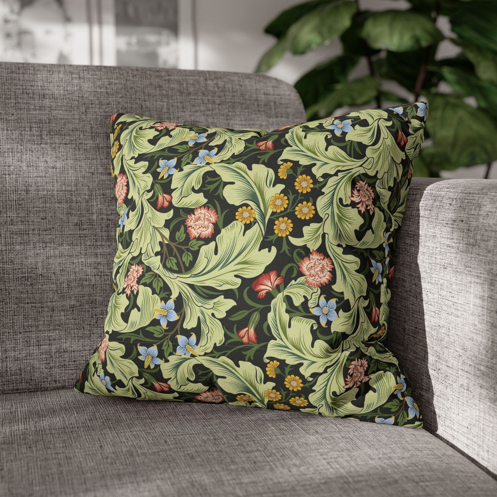 Decorative pillow with floral pattern on a gray sofa - William Morris Leicester