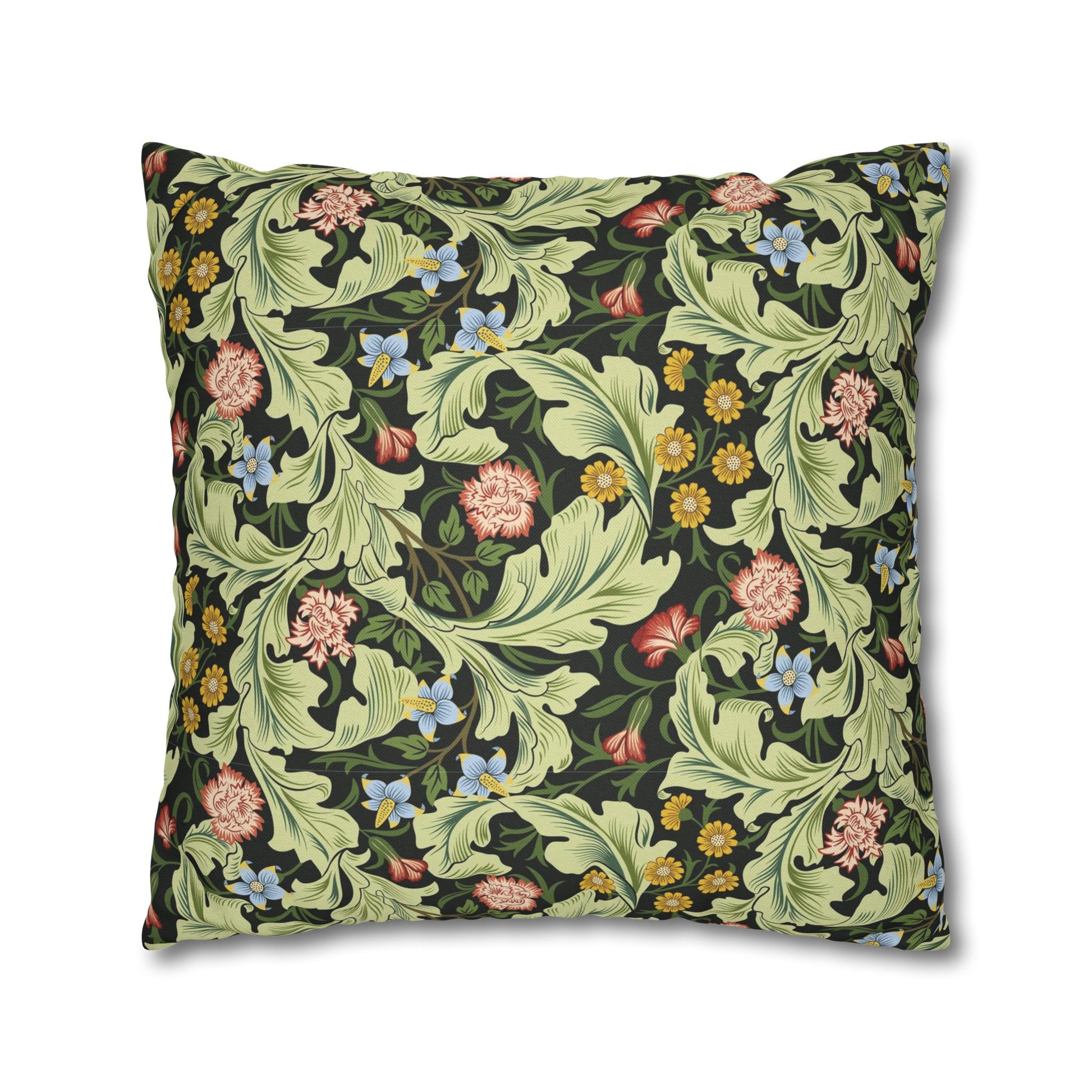Floral patterned pillow with green leaves and colorful flowers on a white background - William Morris Leicester