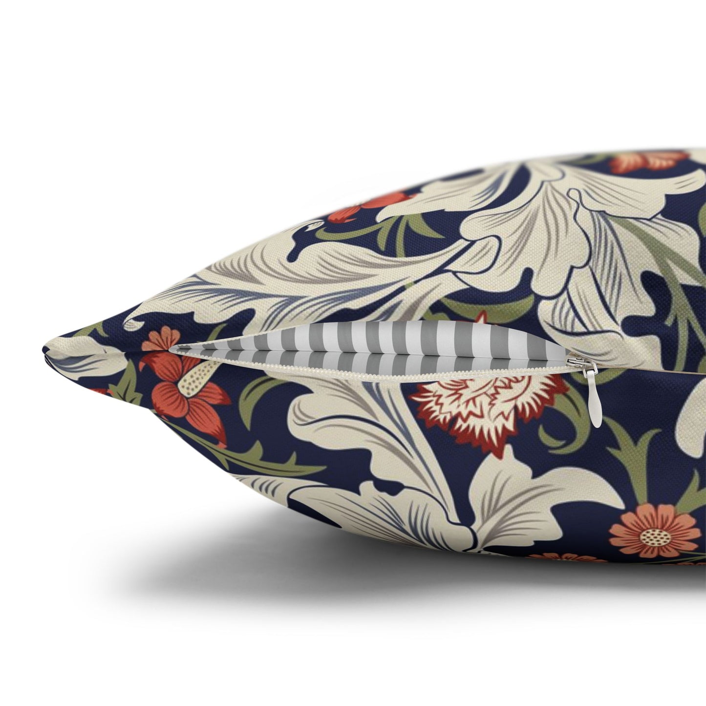 Floral-patterned pillow with a zipper on a white background