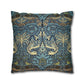 Decorative pillow with intricate floral and bird pattern on a blue background