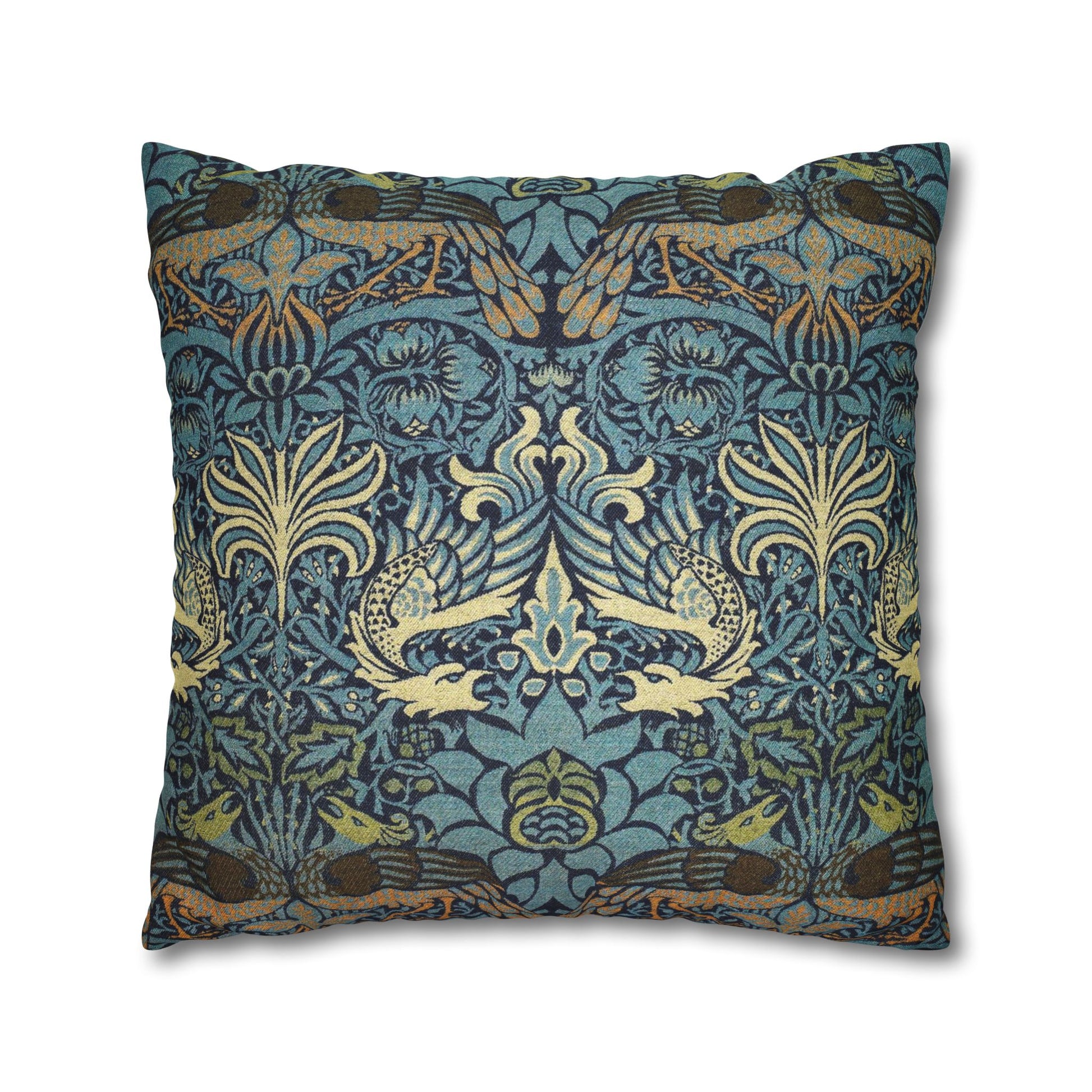Decorative pillow with intricate floral and bird pattern on a blue background