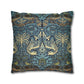 Decorative pillow with intricate blue and gold pattern on a white background
