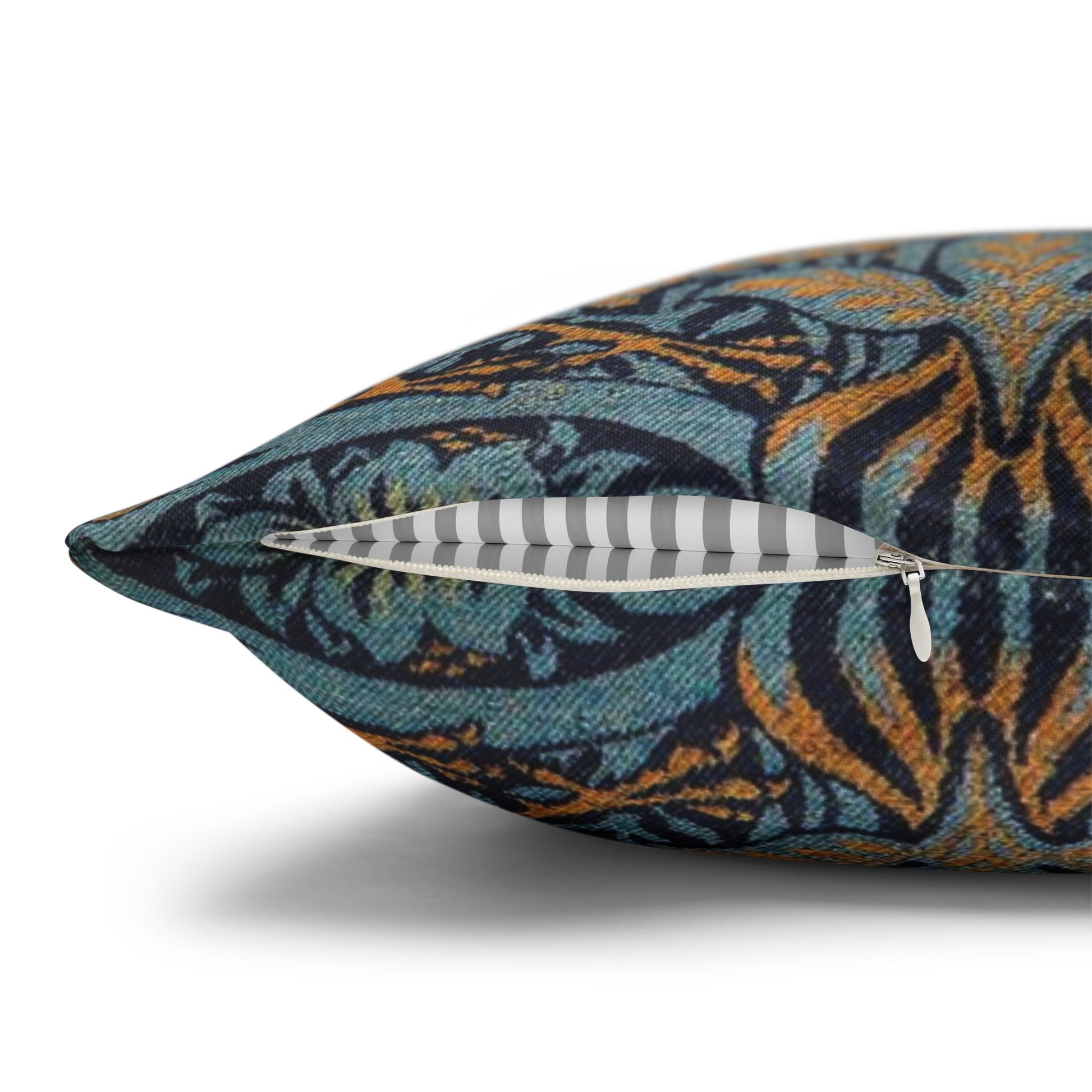 Decorative pillow with a floral pattern and feathers on a white background