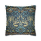 Decorative pillow with intricate blue and gold pattern on a white background