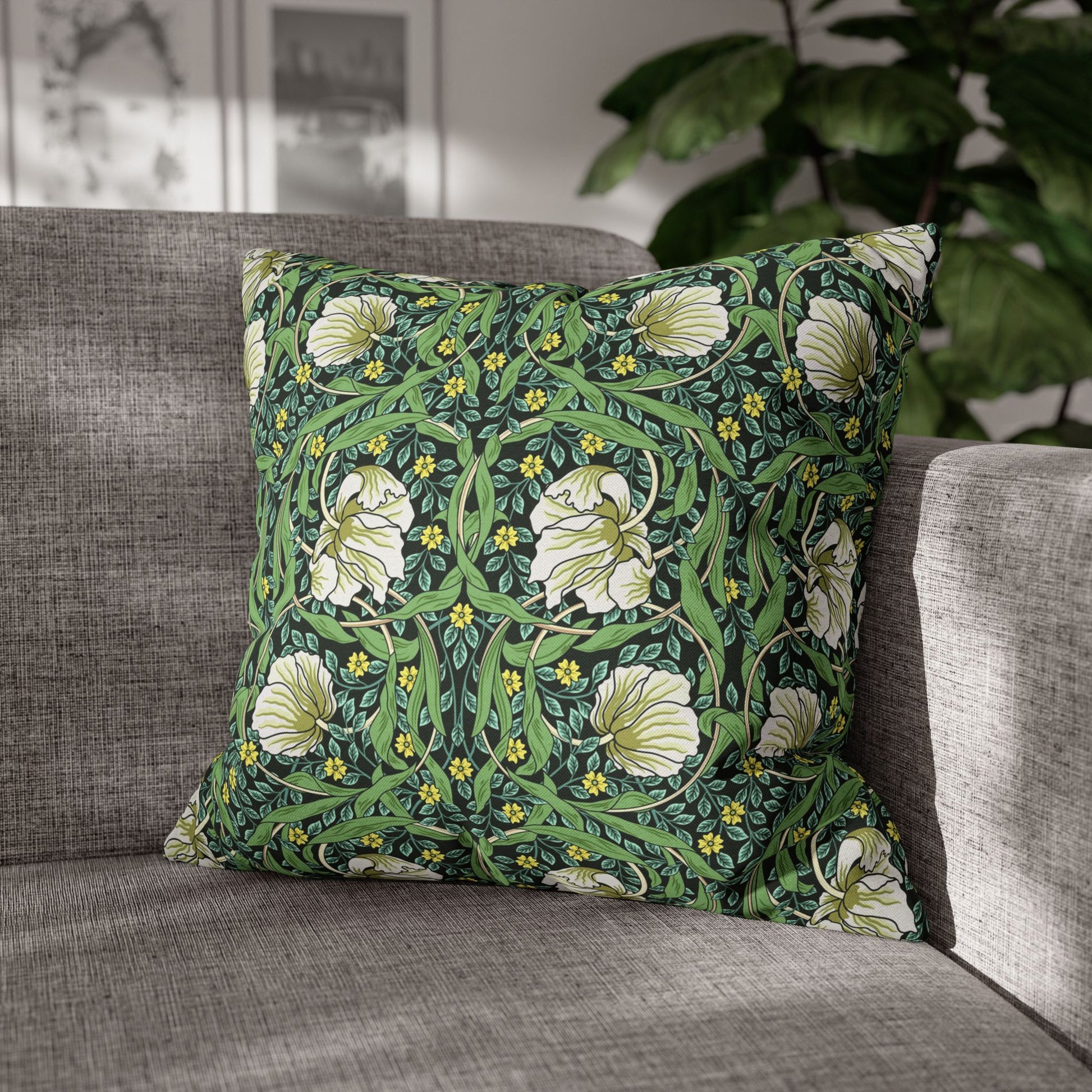 Decorative pillow with floral pattern on a gray sofa