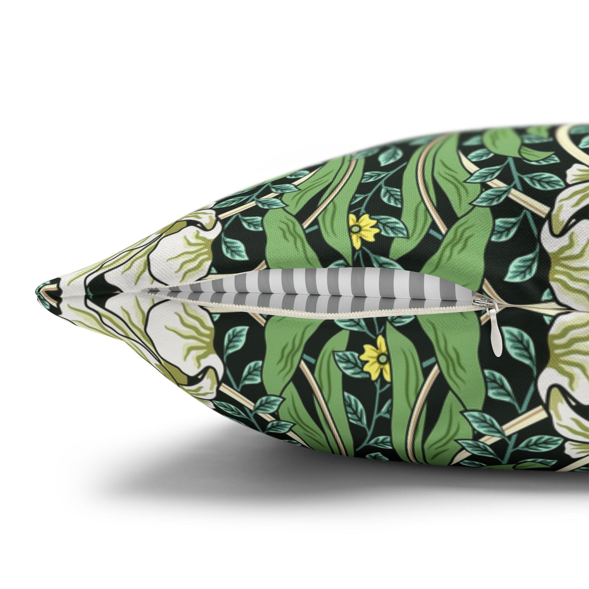 Decorative pillow with a green floral pattern on a white background