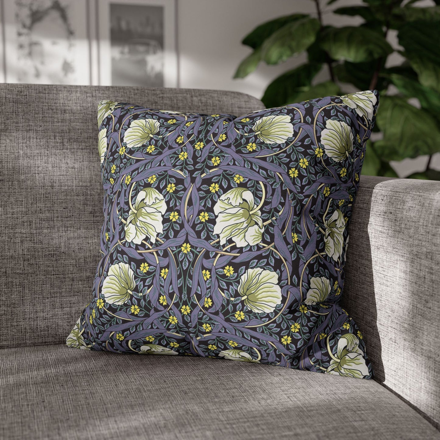 Decorative pillow with floral pattern on a gray sofa