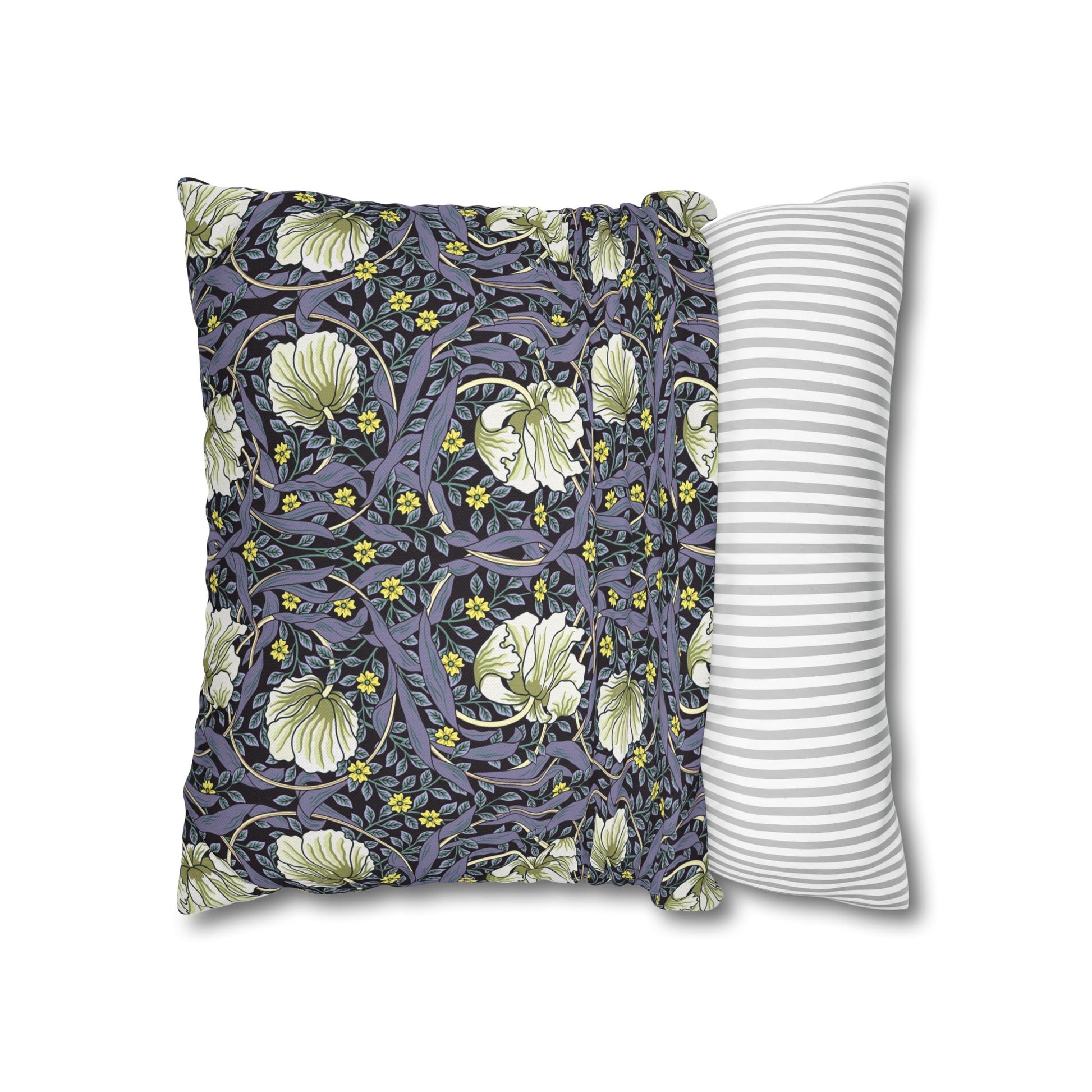 Two pillows, one with floral pattern and one with stripes, on a white background