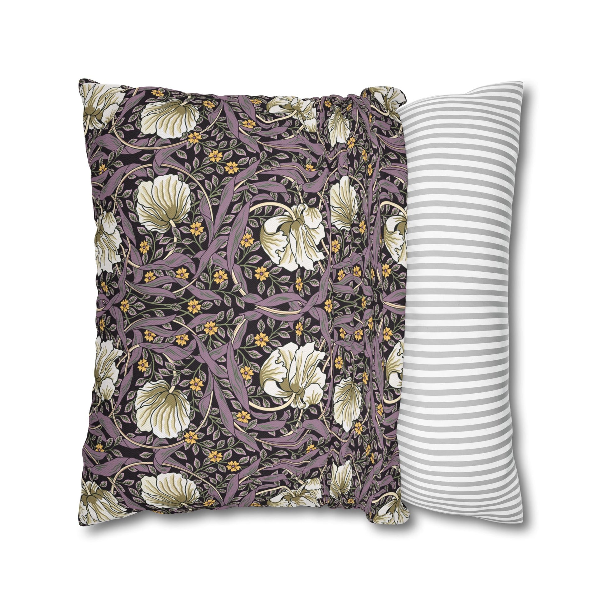 Two pillows, one with floral pattern and one with stripes, on a white background