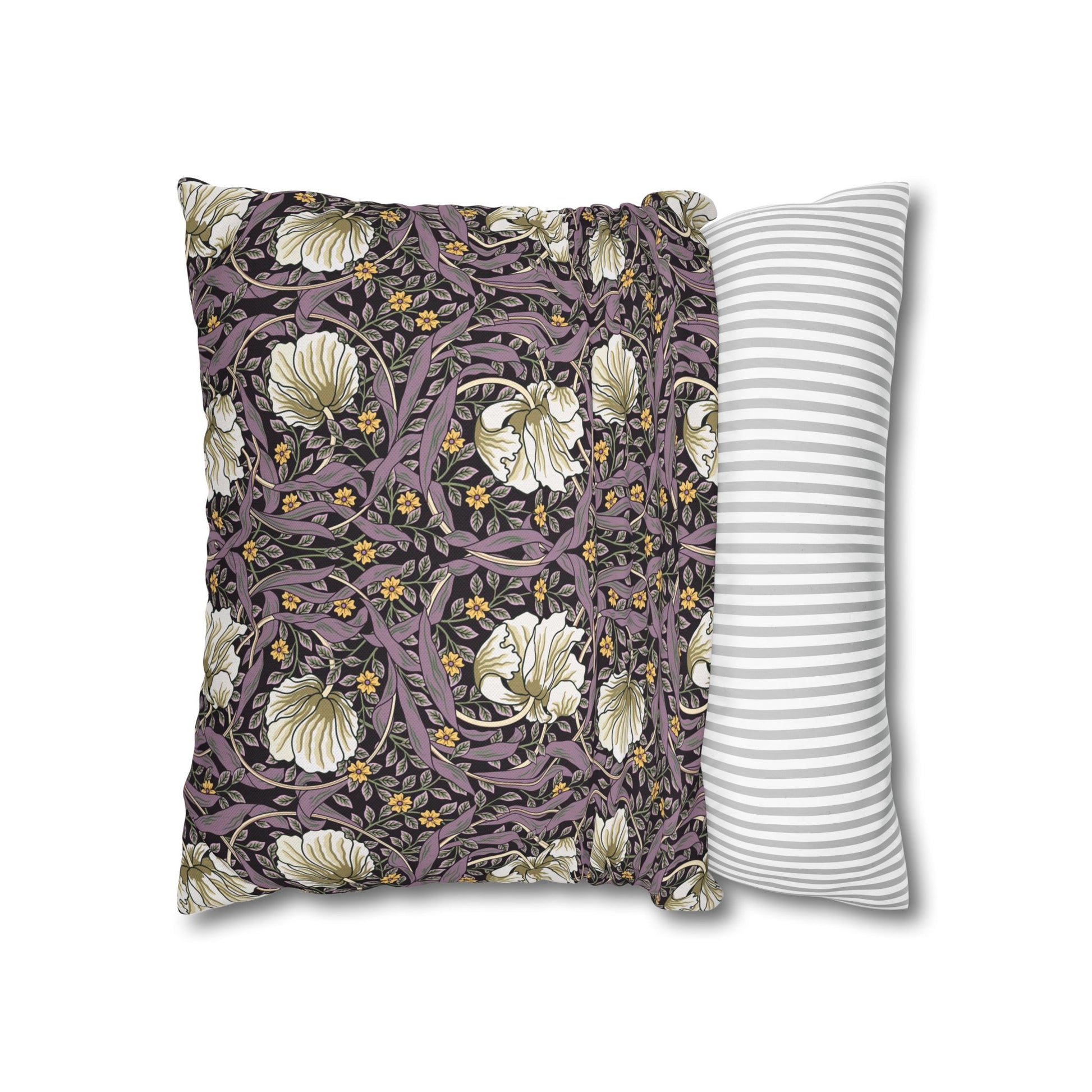 Two pillows, one with floral pattern and one with stripes, on a white background