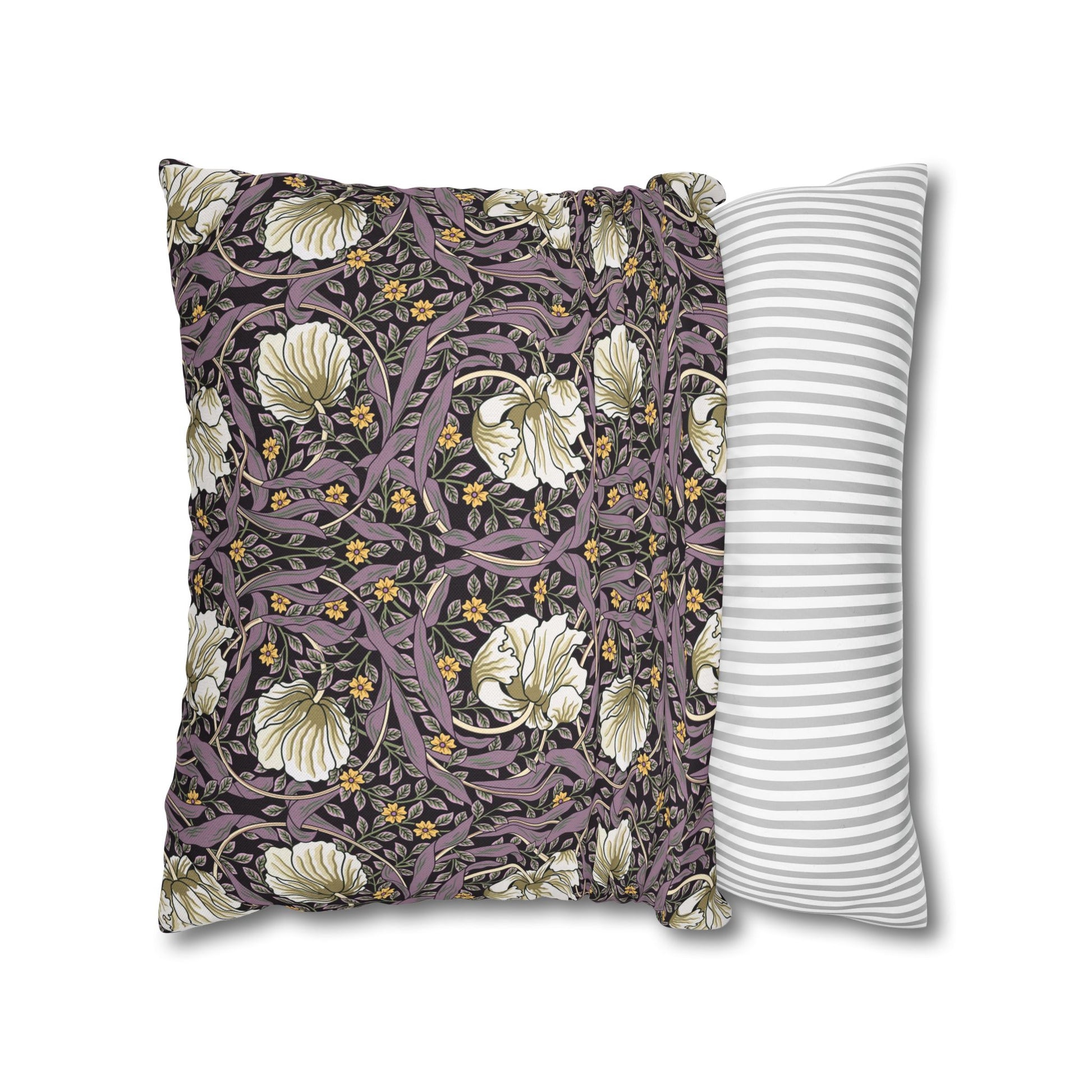 Two pillows, one with floral pattern and one with stripes, on a white background