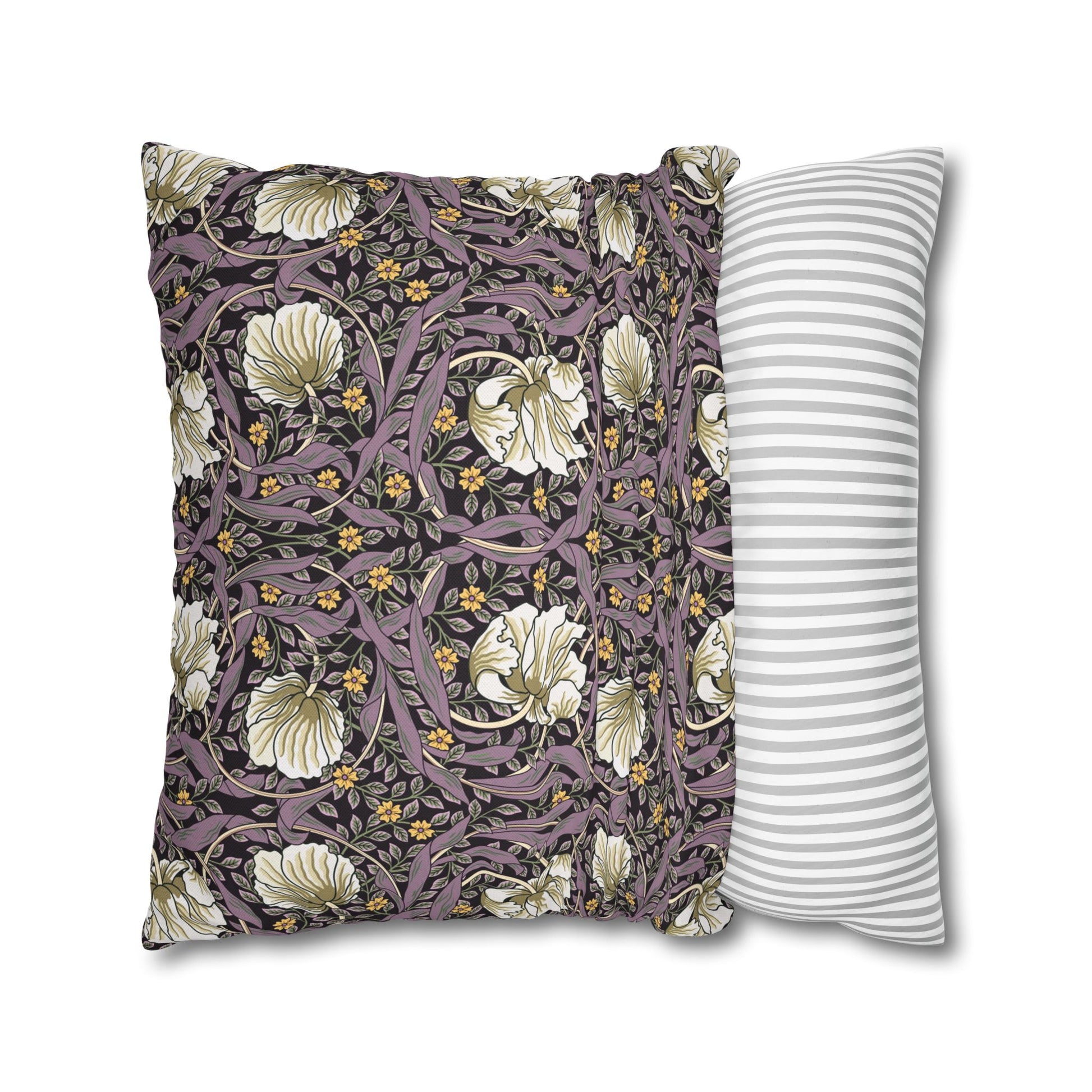 Two pillows, one with floral pattern and one with stripes, on a white background