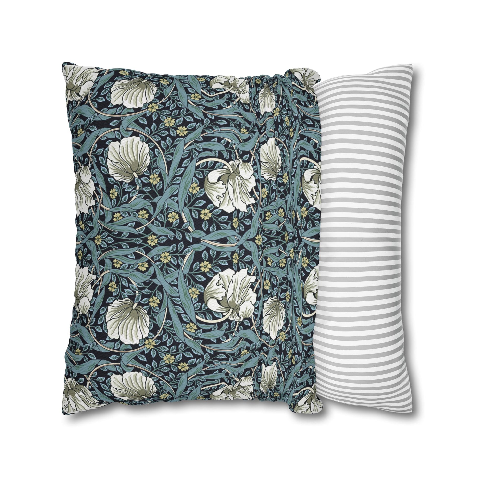 Two pillows, one with floral pattern and one with stripes, on a white background