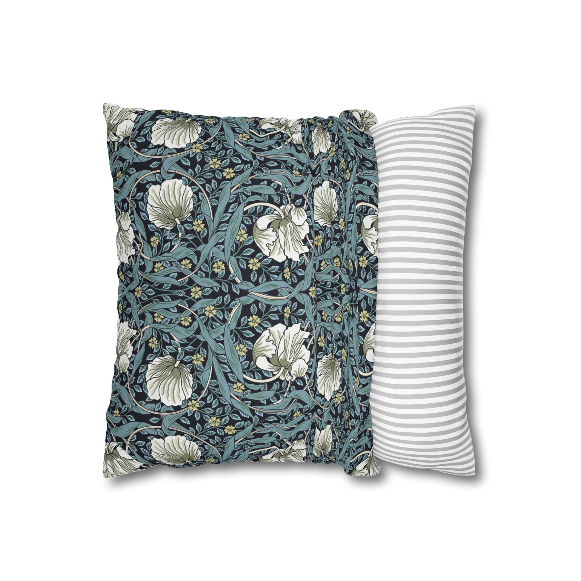 Floral-patterned pillow and striped pillow on a white background