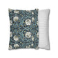 Two pillows, one with floral pattern and one with stripes, on a white background