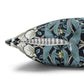 Decorative pillow with floral pattern and feather on a white background