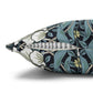 Decorative pillow with floral pattern and feathers on a white background