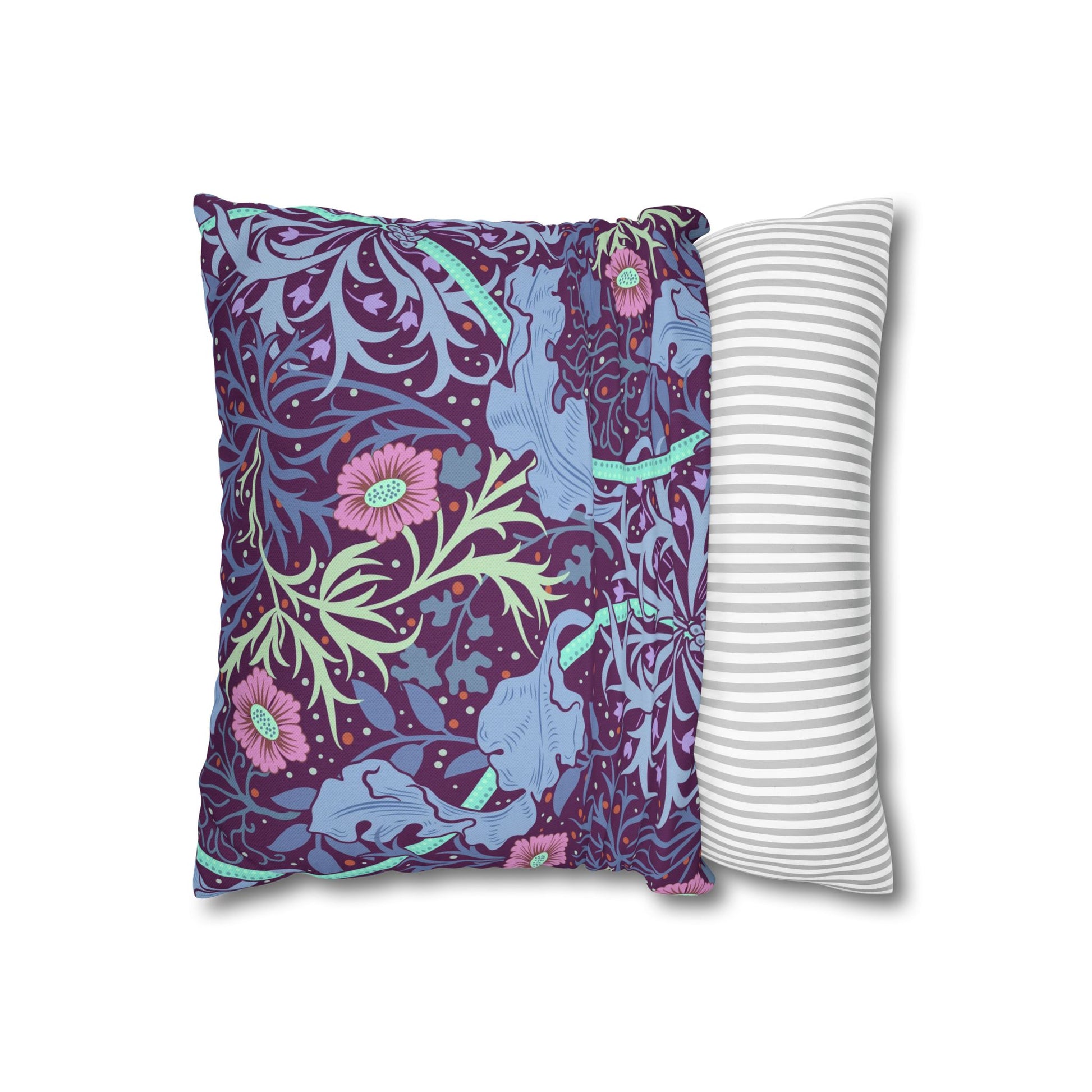 Two pillows, one with a floral pattern and the other with a striped pattern, on a white background.