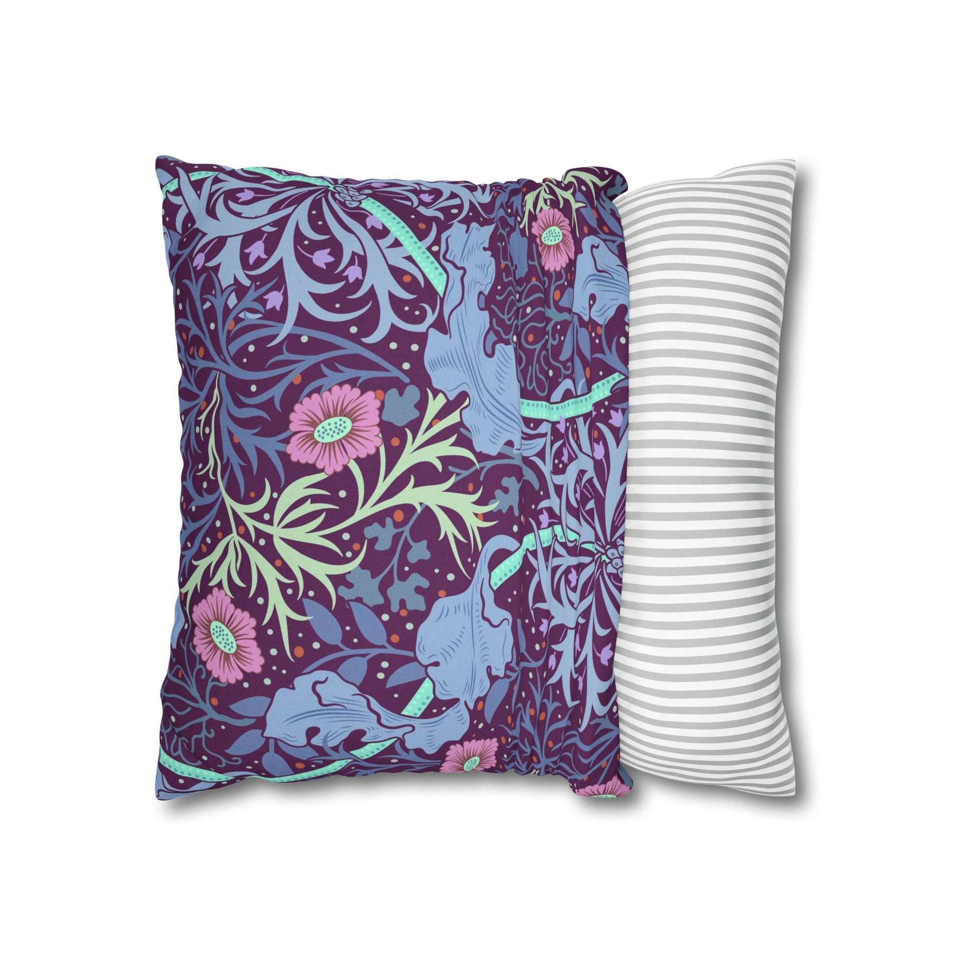 Two pillows, one with a floral and animal pattern and the other with a striped design, on a white background.