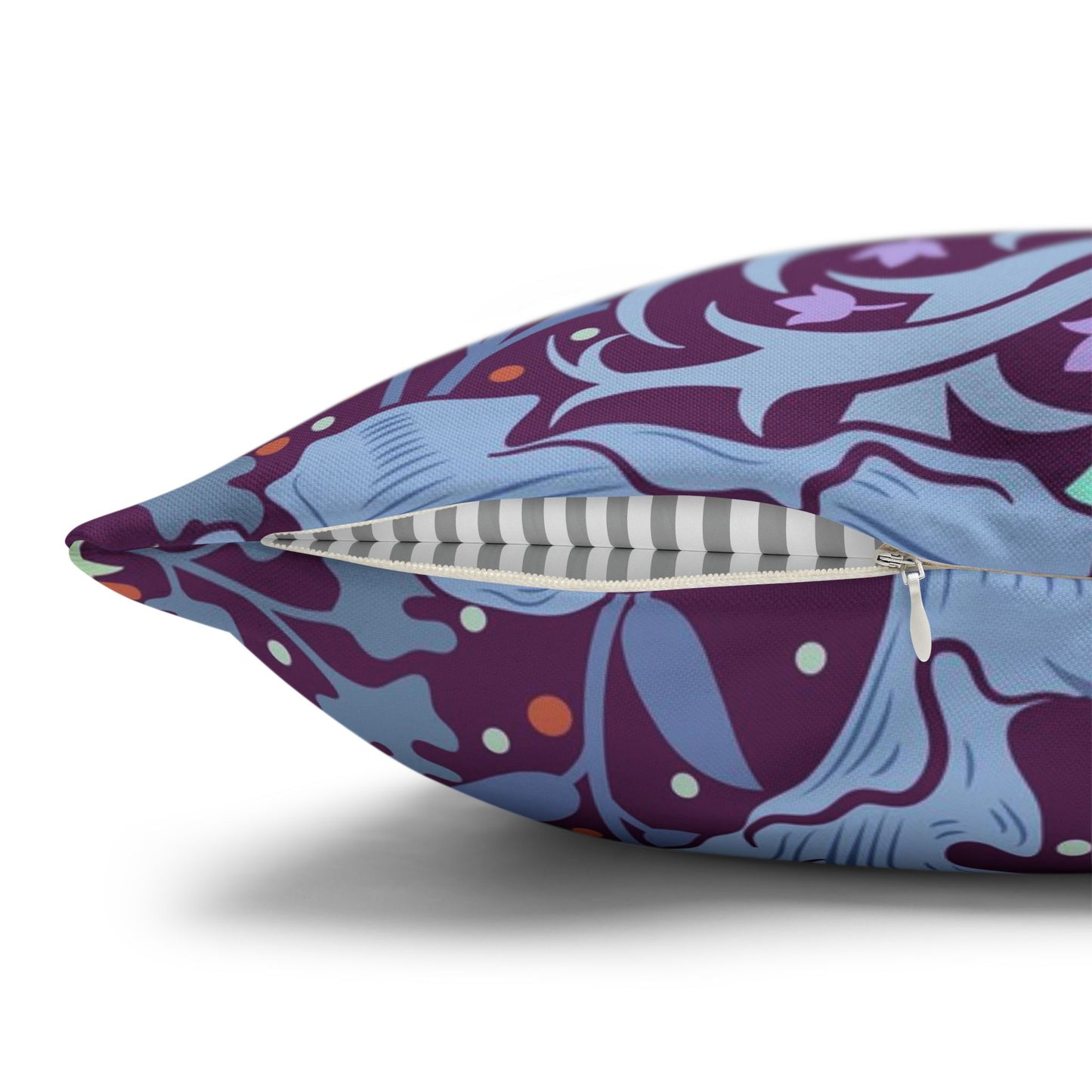 Decorative pillow with a purple and blue pattern on a white background