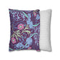 Two pillows, one with a floral and elephant pattern and the other with a striped pattern, on a white background.