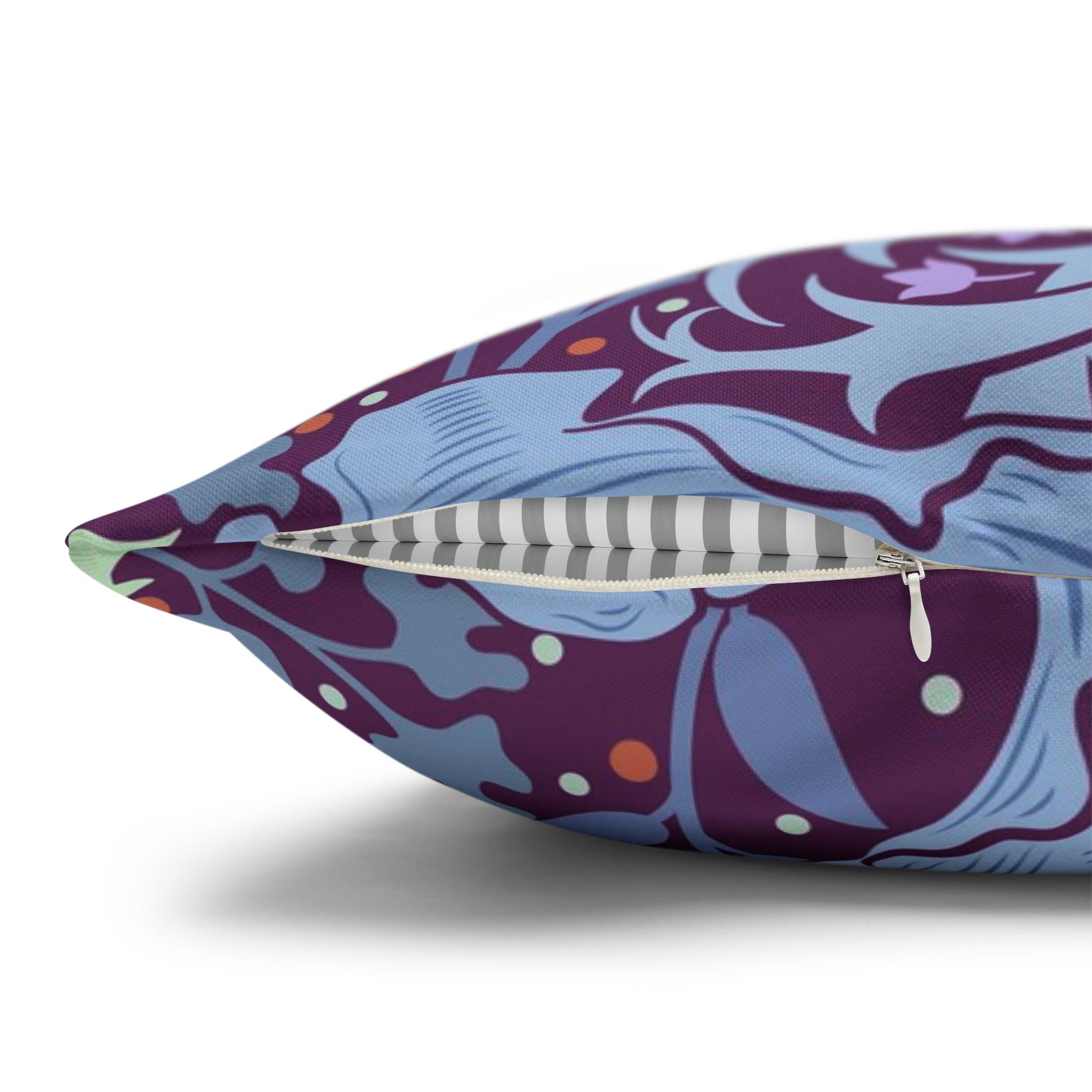 Decorative pillow with a purple and blue pattern on a white background