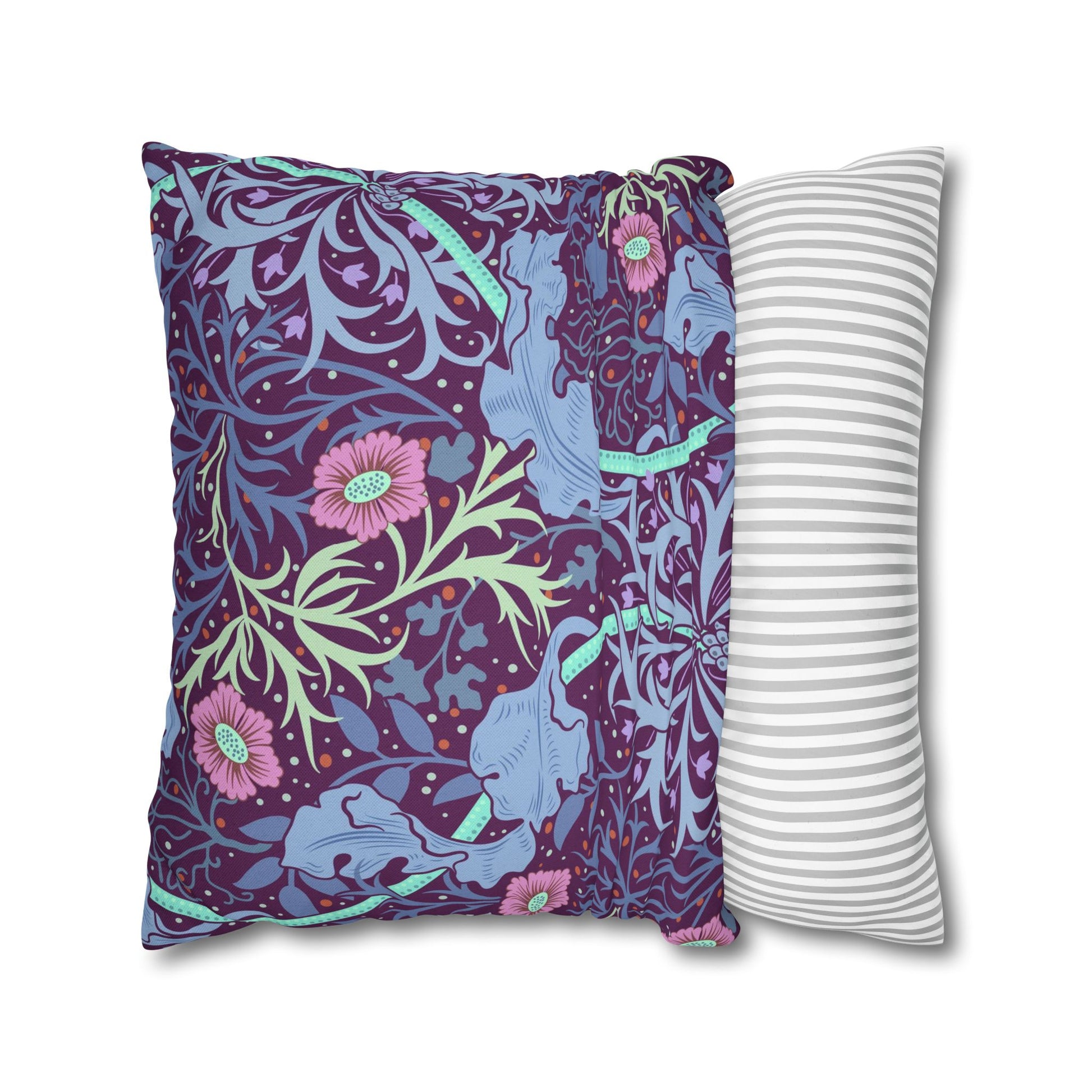 Two pillows, one with a floral pattern and the other with a striped pattern, on a white background.