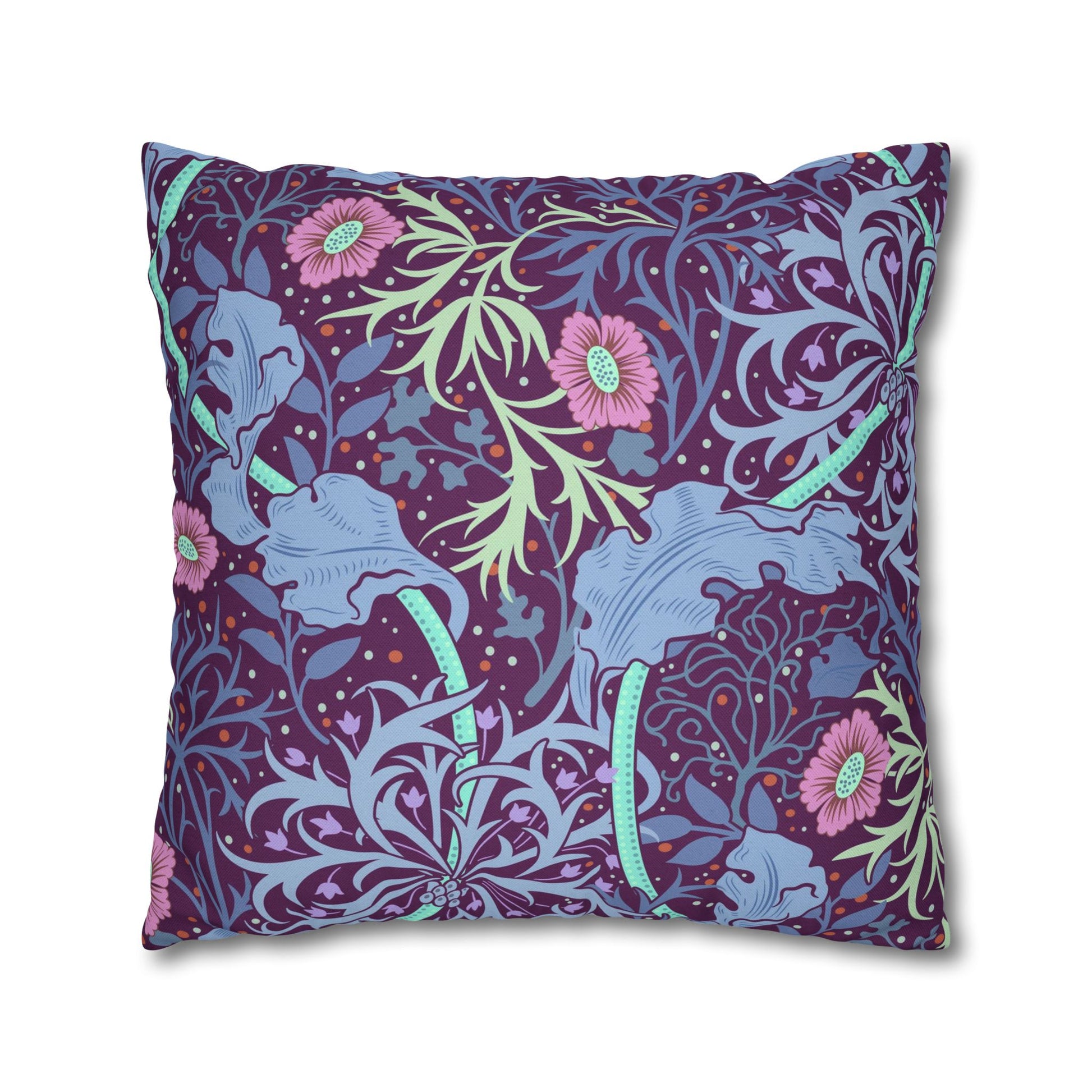 Decorative pillow with floral and elephant pattern on a white background