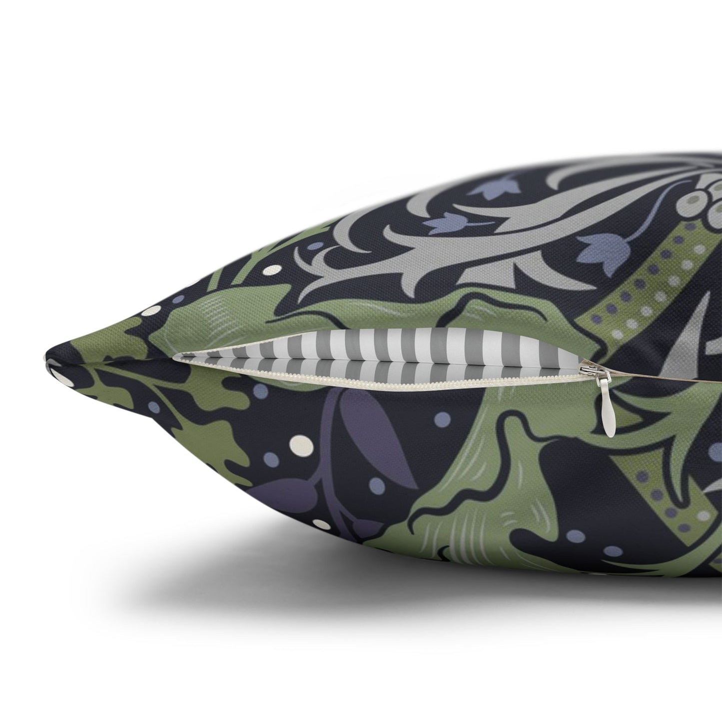 Decorative pillow with a green and purple pattern on a white background