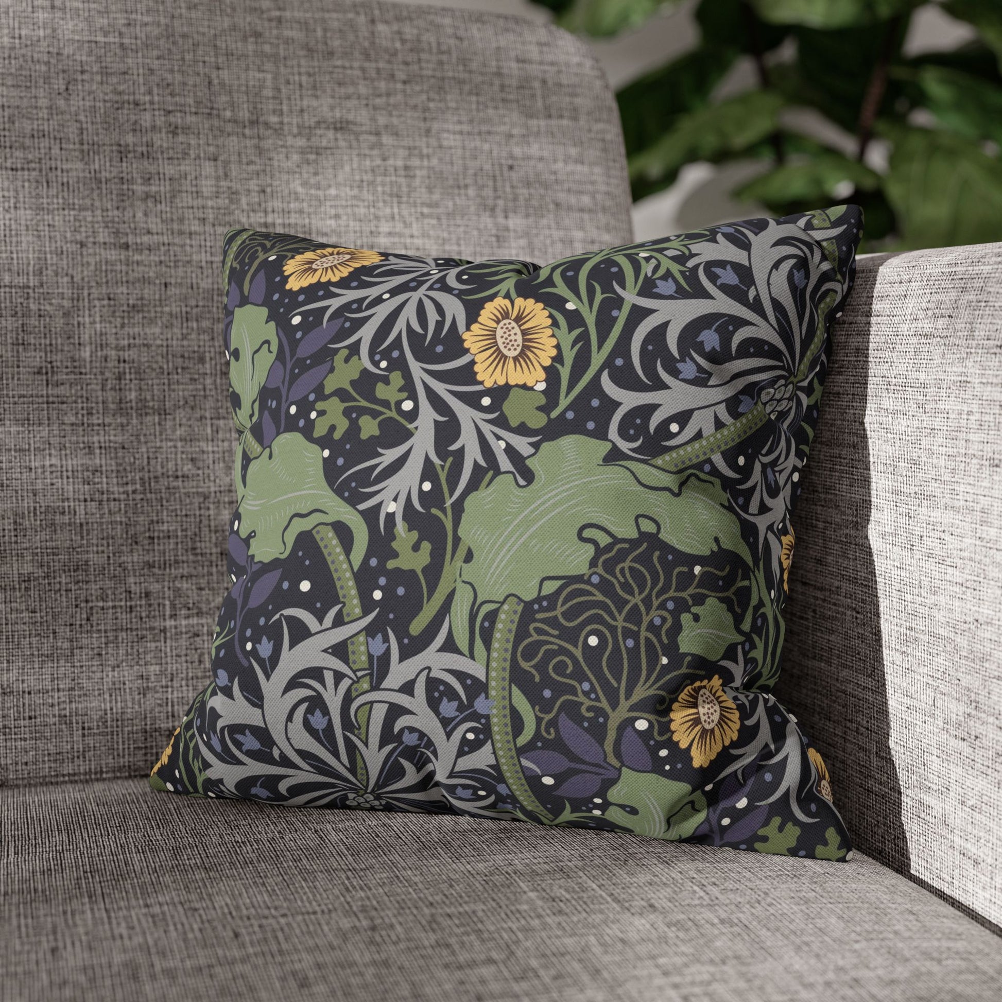Decorative pillow with floral pattern on a gray sofa