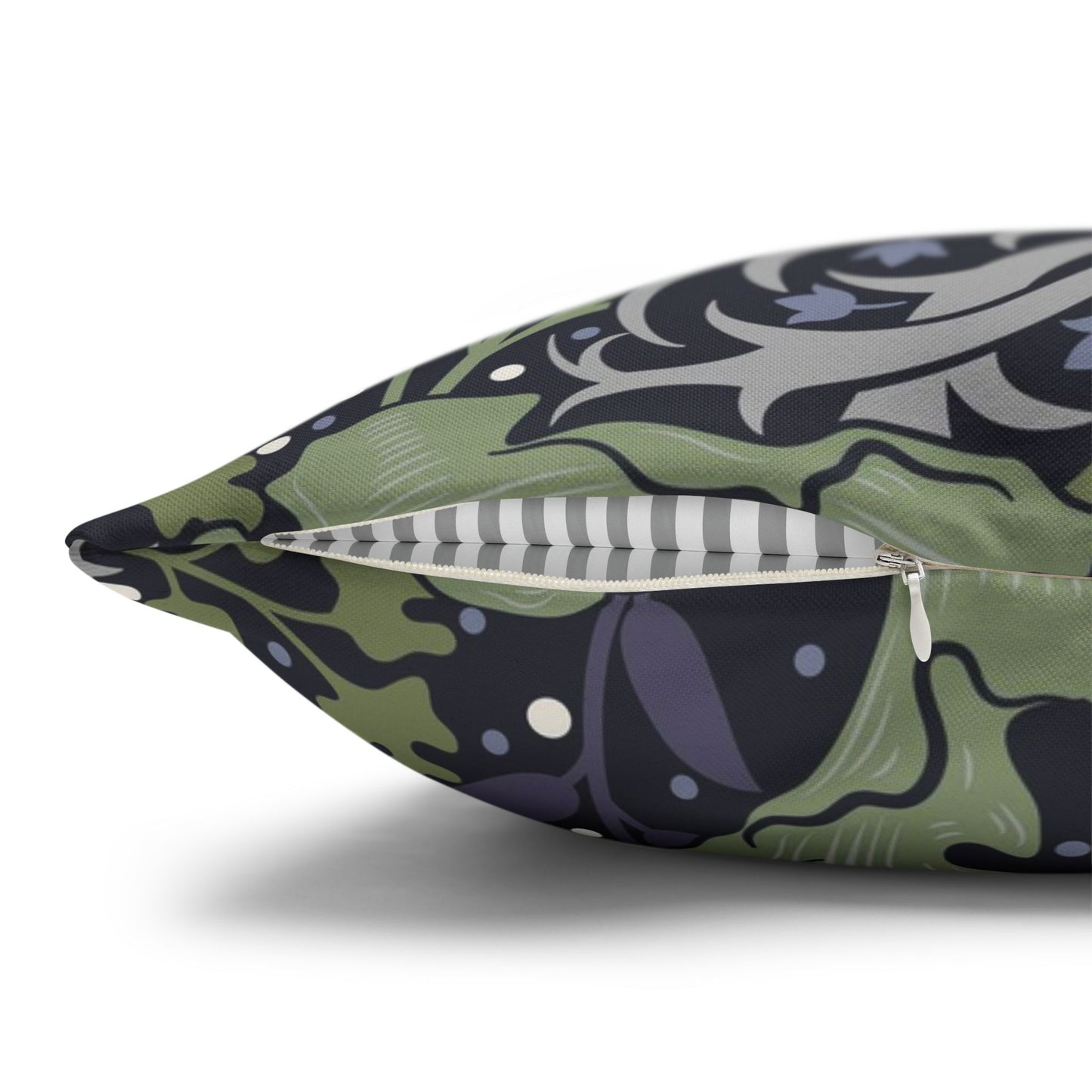 Decorative pillow with a green and purple pattern on a white background