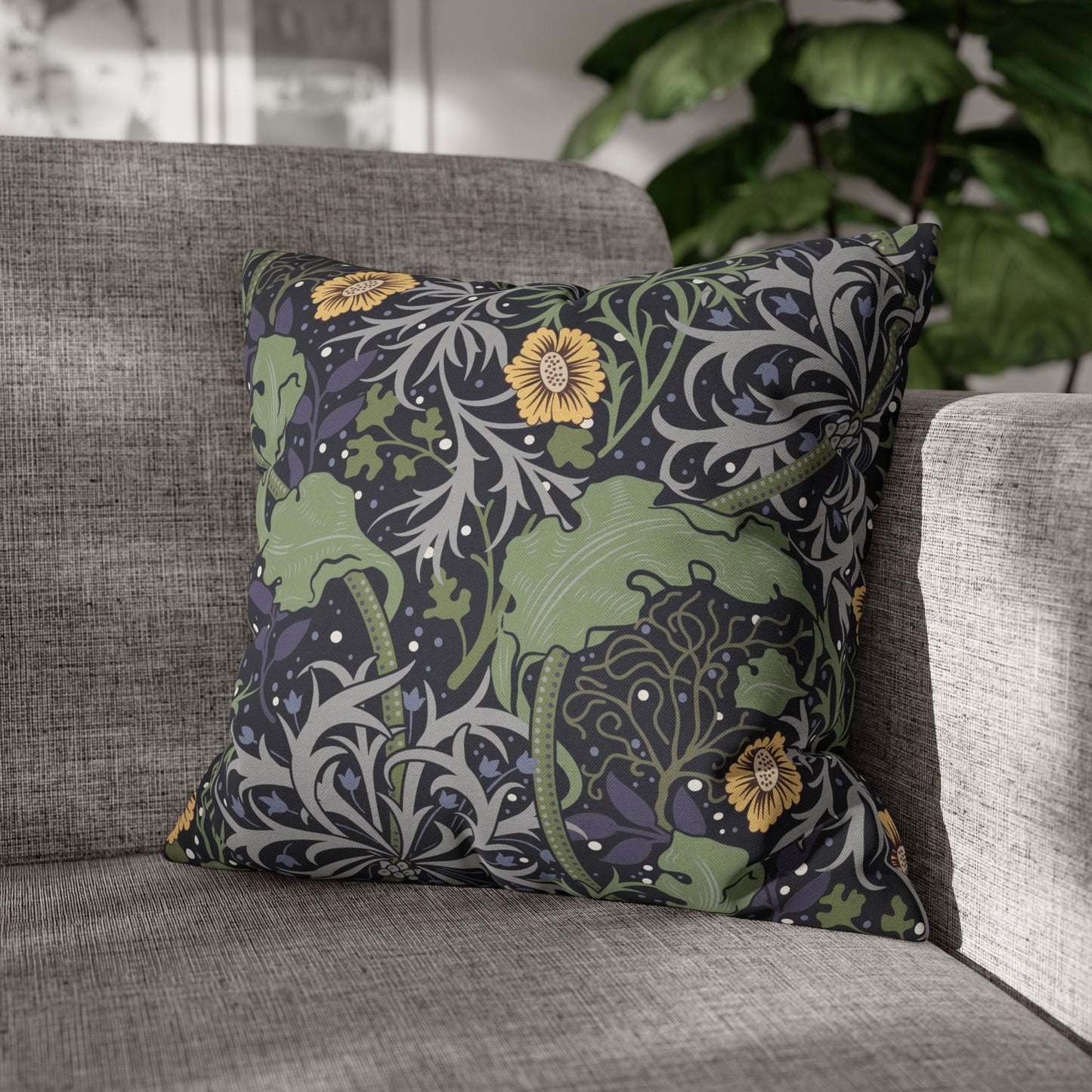 Decorative pillow with floral pattern on a gray sofa