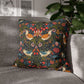 Decorative pillow with floral and bird pattern on a gray sofa