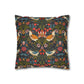 Decorative pillow with floral and bird pattern on a white background