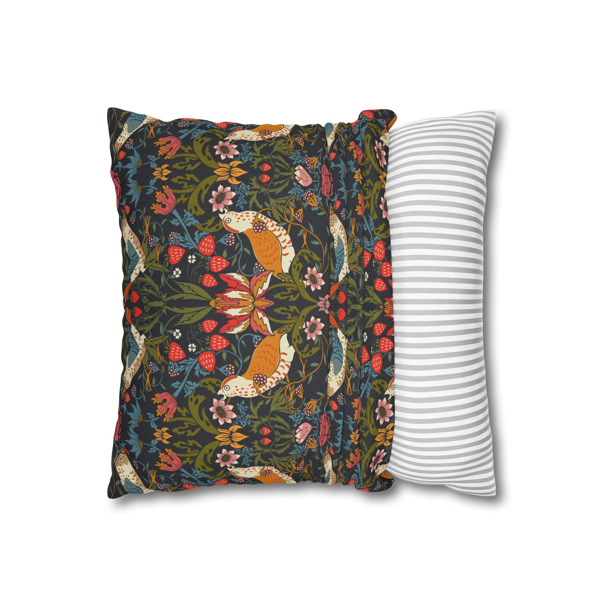 Decorative pillow with fox and floral pattern next to a striped pillow on a white background