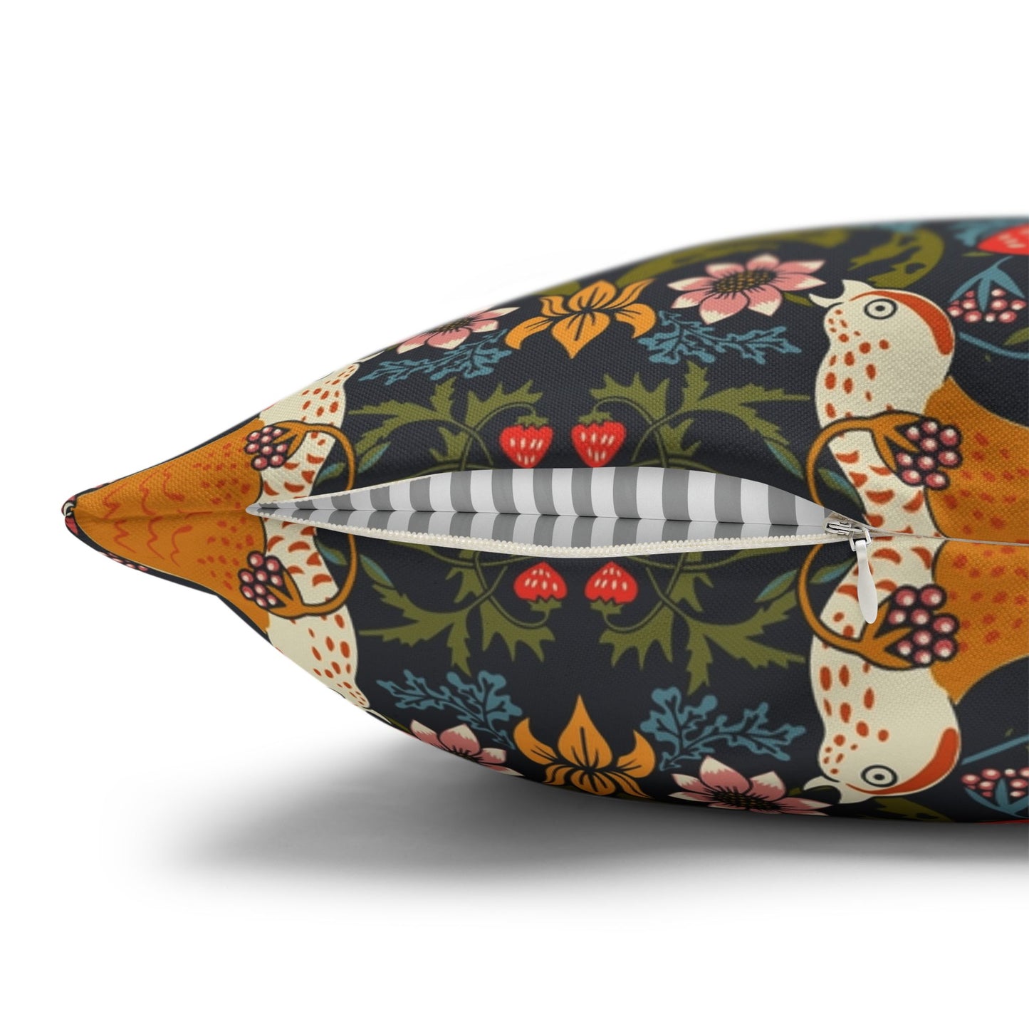 Decorative pillow with a colorful floral and animal pattern on a white background